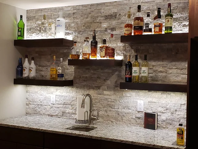 Waukesha Basement Remodel with a stone bar by Reality Construction
